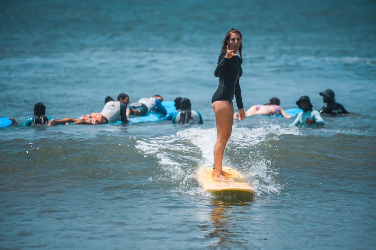 Happy Surfer girl on the board
