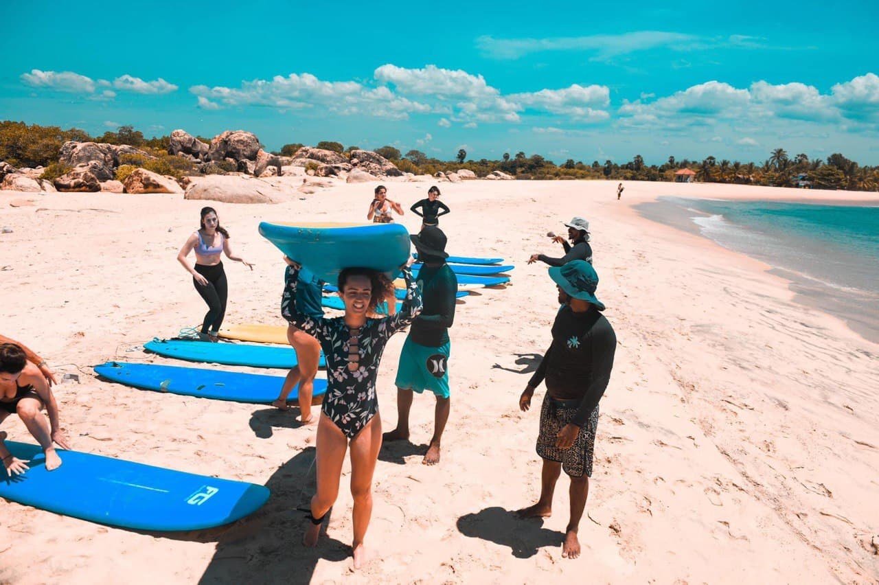 Surfer girls ready to catch the waves